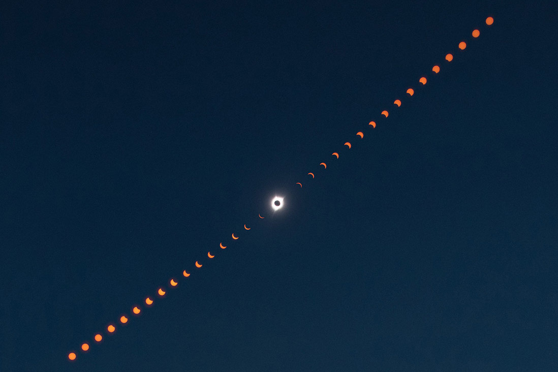 This image is a composite photograph that shows the progression of the total solar eclipse over Madras, Oregon. This image is a composite photograph that shows the progression of the total solar eclipse over Madras, Oregon.